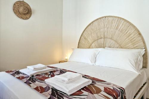 Katil atau katil-katil dalam bilik di Pola Rooms - Guesthouse by Host Hero
