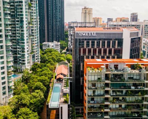 an aerial view of a city with tall buildings at M Social Singapore in Singapore