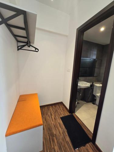 a small room with a bench and a mirror at K Avenue Kota Kinabalu by Merveille - Sabah in Donggongon