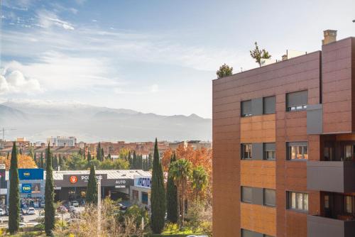 a view of a city from a building at EnjoyGranada New Suite EMIR in Granada