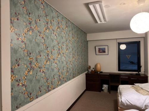 Postel nebo postele na pokoji v ubytování Guest House Ichiyama Shukuba