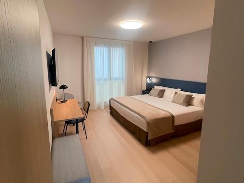 Postel nebo postele na pokoji v ubytování Hotel Real