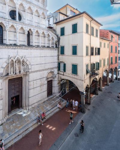 a group of people standing outside of a building at Single House in Pisa