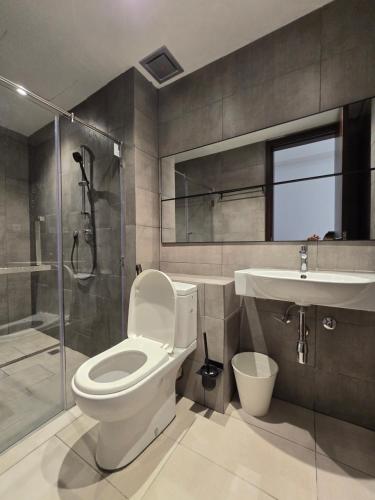 a bathroom with a toilet and a shower and a sink at K Avenue Kota Kinabalu by Merveille - Sabah in Donggongon