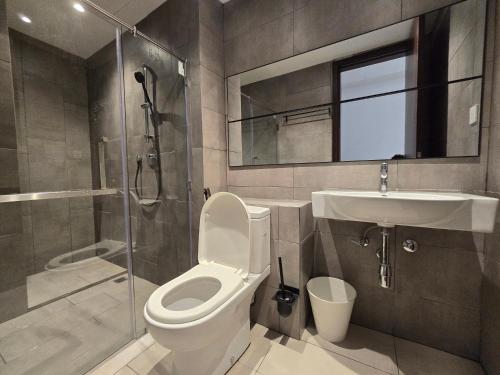 a bathroom with a toilet and a shower and a sink at K Avenue Kota Kinabalu by Merveille - Sabah in Donggongon