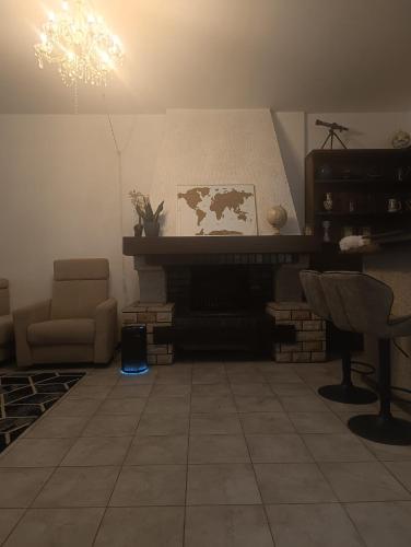 a living room with a couch and a fireplace at Dom blisko lotniska i Areny Tarczyńskiego in Wrocław
