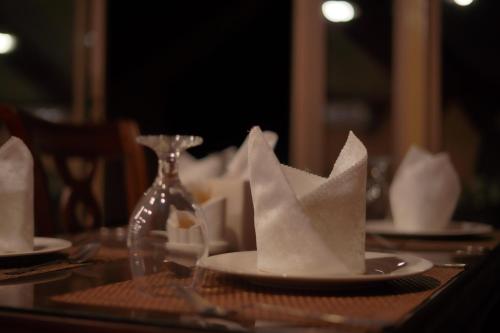 a plate with a paper boat on a table at Mars Land Luxury Camp in Wadi Rum
