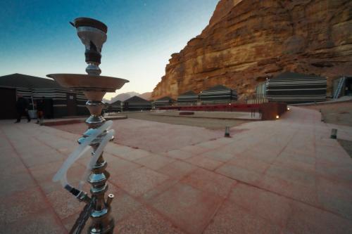 a camera on a tripod in front of a mountain at Mars Land Luxury Camp in Wadi Rum