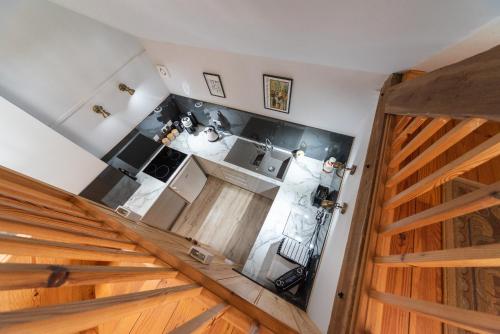 an overhead view of a kitchen with wooden floors at Hop Cottage Coddington Vineyard in Ledbury
