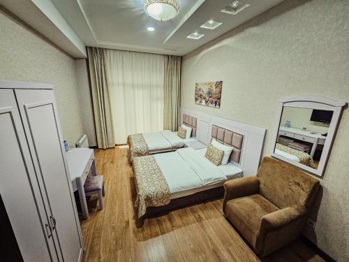 Postel nebo postele na pokoji v ubytování Safran Hotel