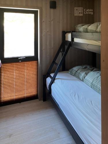 Ένα ή περισσότερα κρεβάτια σε δωμάτιο στο New modern cabin at Norefjell with sauna