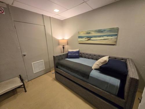 a bedroom with a bed in a room at BUNKER BEACH @ ISLA VERDE / Beach Front in San Juan