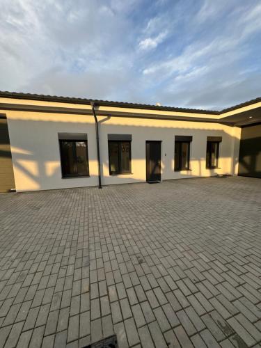 a large white building with a lot of windows at Balon Centrum penzion in Plav