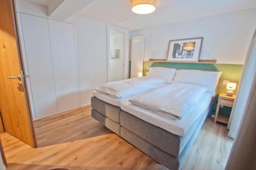 a small bedroom with a bed in a room at Chalet Aeschhorn in Zermatt
