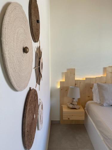 a bedroom with a bed and a clock on the wall at Tropical Suite 22 B in Santa Maria