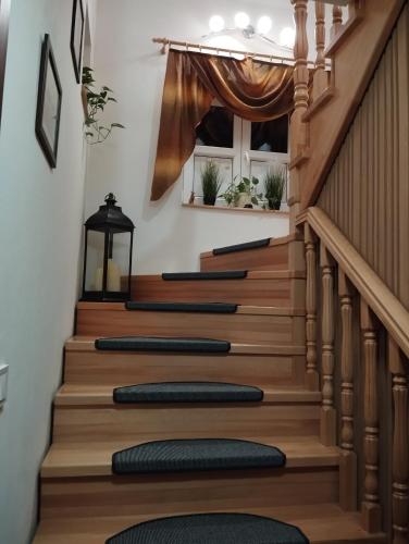 a set of stairs in a home with a curtain at Ubytovani u Nadii in Železný Brod