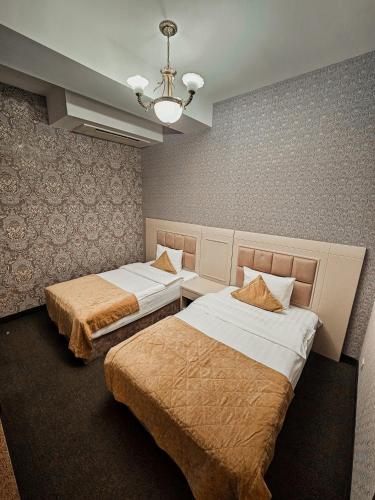 Кровать или кровати в номере Safran Hotel