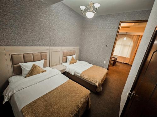 Кровать или кровати в номере Safran Hotel