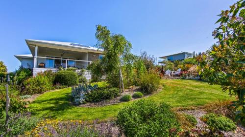a house with a garden in front of it at Waves and Blossoms in Cunninghame