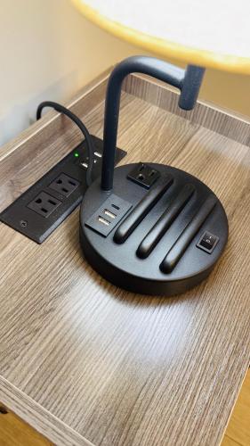 a black computer mouse sitting on top of a table at Niagara Getaway across Fallsview in Niagara Falls
