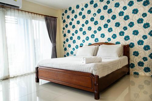 Ένα ή περισσότερα κρεβάτια σε δωμάτιο στο Alisa Krabi Hotel-SHA Plus