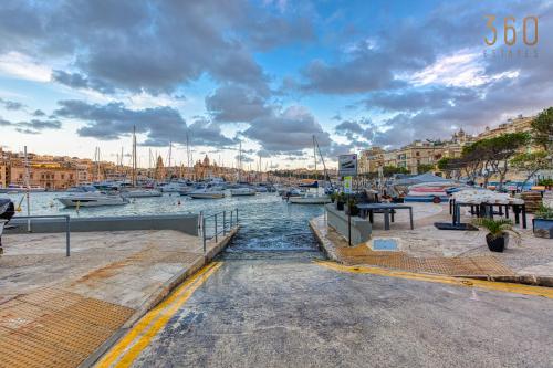 a group of boats docked in a marina at Maltese Maisonette in Historic Isla with Sea Views by 360 Estates in Senglea