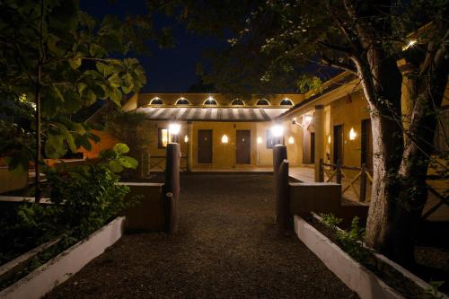 an exterior view of a house at night at Treebo Premium Mowgli's Den, Pench in Khawāsa
