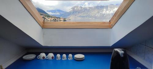 a window in a bathroom with a view of a mountain at Villa Kamena in Kotor