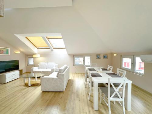 a living room with a couch and a table at Old City Views - Luxury 2BDR Apt & Free Parking in Sofia