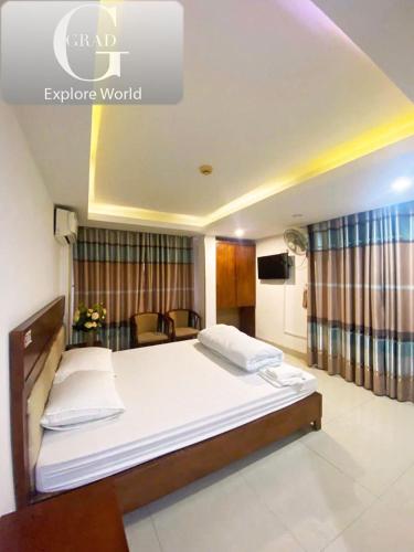 a bedroom with a large bed in a room at Hanoi Gold Hotel in Hanoi