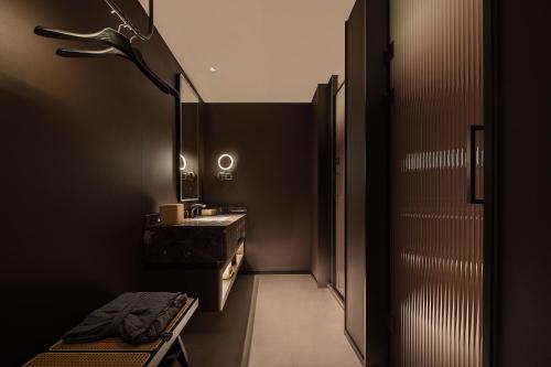 a bathroom with a sink and a mirror at Atour Hotel Haikou Longhua Jinniuling Park in Haikou