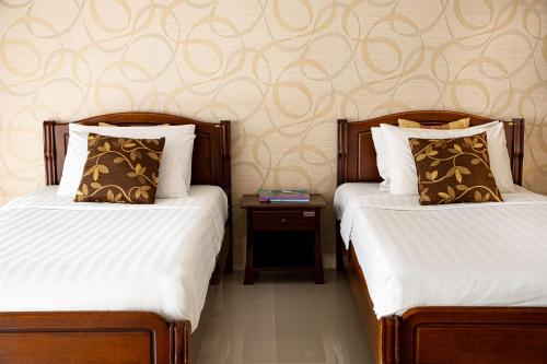 Ένα ή περισσότερα κρεβάτια σε δωμάτιο στο Alisa Krabi Hotel-SHA Plus