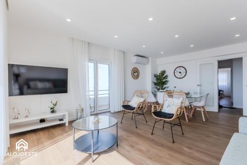 a living room with a table and chairs at Apartamento Vista Mar - 4 bedroom apt - Sea View in Santa Cruz