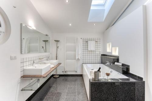a bathroom with two sinks and a large mirror at Residence Margherita in Ugento