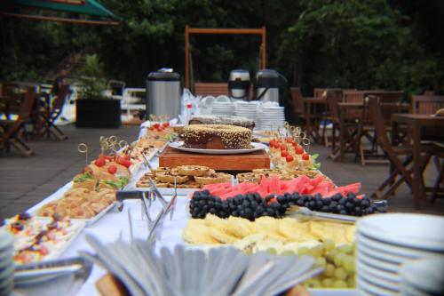a table with a buffet of food on it at Uiara Amazon Resort in Manaus