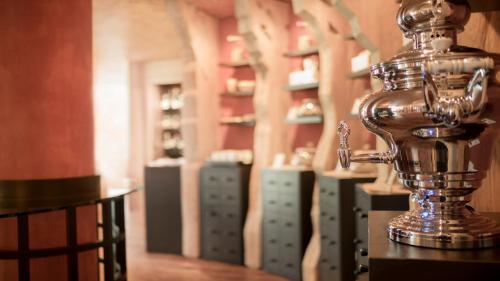 a silver trophy sitting on a table in a room at Adler Spa Resort Balance in Ortisei