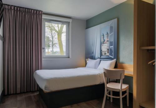Postel nebo postele na pokoji v ubytování B&B HOTEL Metz Semécourt