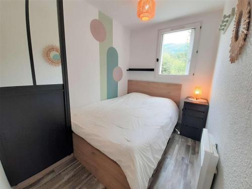 Posteľ alebo postele v izbe v ubytovaní Charmant T2 à Saint-Lary-Soulan, 4 pers., balcon sud-ouest, parking, proche thermes - FR-1-457-322