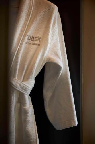 a white shirt with the word justice on it at Dusit Suites Hotel Athens in Athens