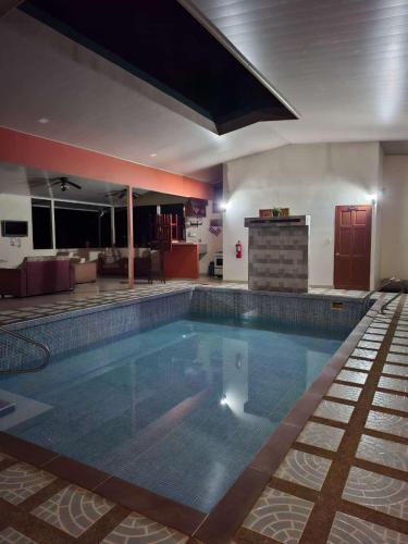 a large swimming pool in a hotel room at Hotel San Rafael Ecolodge in San Gerardo
