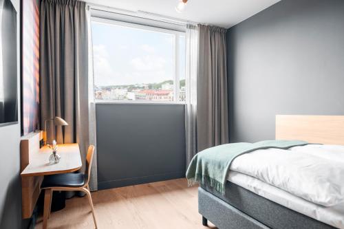 En eller flere senge i et værelse på Clarion Hotel Sea U