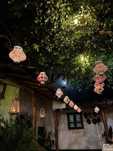 a group of lights hanging from the ceiling of a house at Hacienda Bambusa in El Caimo