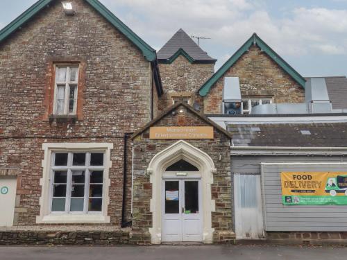 a brick building with a door in front of it at 5 Manor Park in Bideford