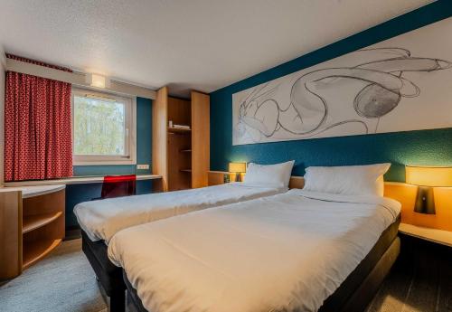 Un ou plusieurs lits dans un hébergement de l'établissement B&B HOTEL Lille Villeneuve d'Ascq Grand Stade