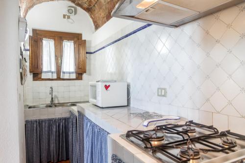 Η κουζίνα ή μικρή κουζίνα στο Agriturismo Bio Fattoria Casetta