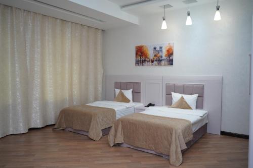 Кровать или кровати в номере Safran Hotel