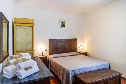 Ένα ή περισσότερα κρεβάτια σε δωμάτιο στο Agriturismo Bio Fattoria Casetta