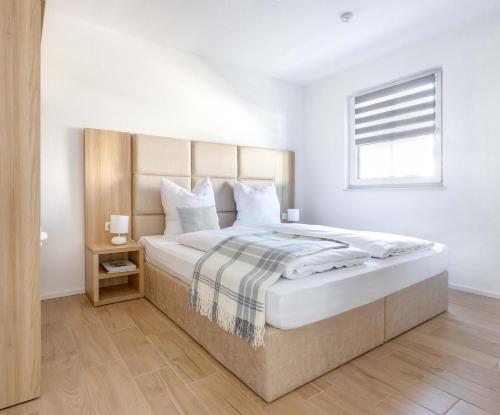 Ένα ή περισσότερα κρεβάτια σε δωμάτιο στο Tiny House Village Löffingen