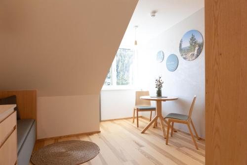 a small dining room with a table and chairs at Forsthaus Apartments - Die Ruheoase nahe Klaffer in Klaffer am Hochficht
