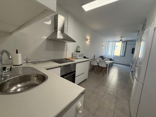 a kitchen with a sink and a counter top at Apartamento Playa Las Vistas in Arona